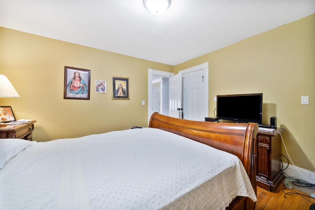 96 Garfield Street Springfield, MA 01108 - Photo 35 of 37 a bedroom with a bed and a flat screen tv