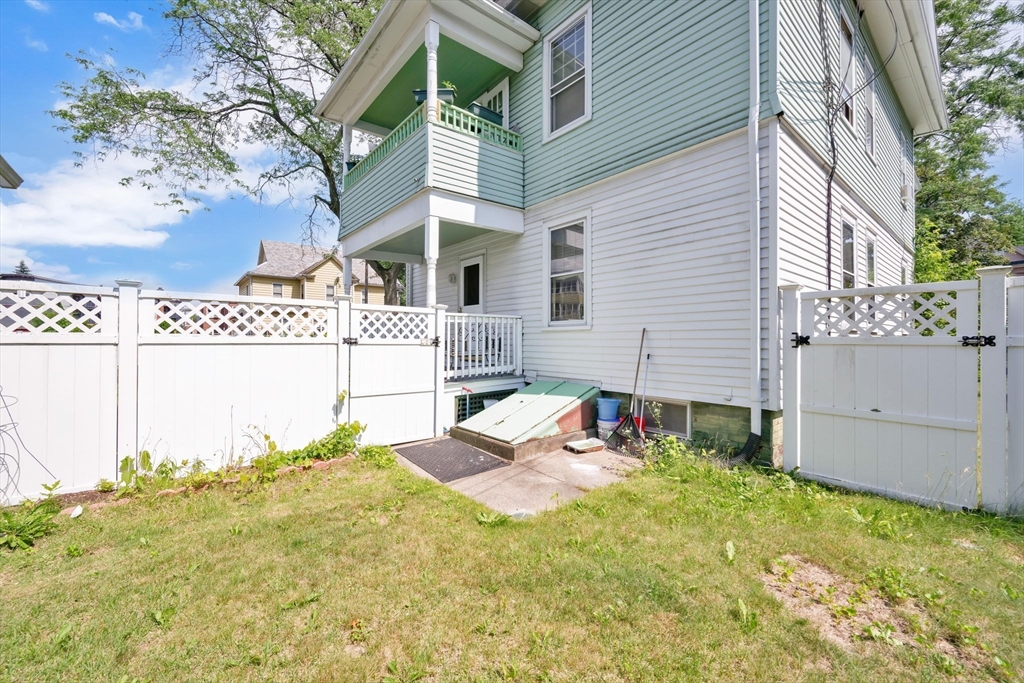 96 Garfield Street Springfield, MA 01108 - Photo 5 of 37 a backyard of a house with table and chairs