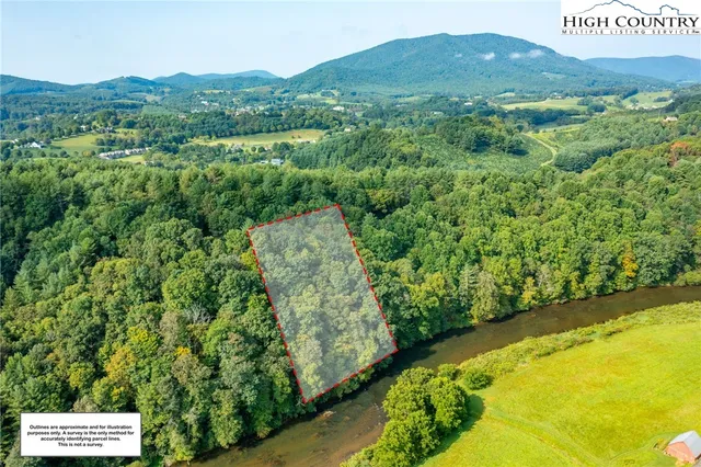 a view of a lush green hillside and a building