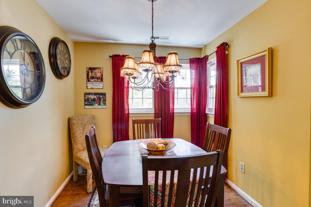 8559 Falls Run Road, Unit E Ellicott City, MD 21043 - Photo 9 of 34 Formal Dining Room, 3 windows