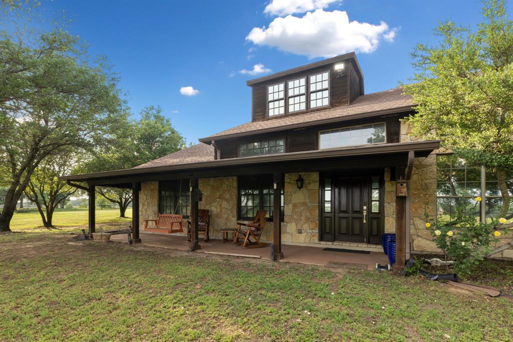 a view of a chairs and table in the patio