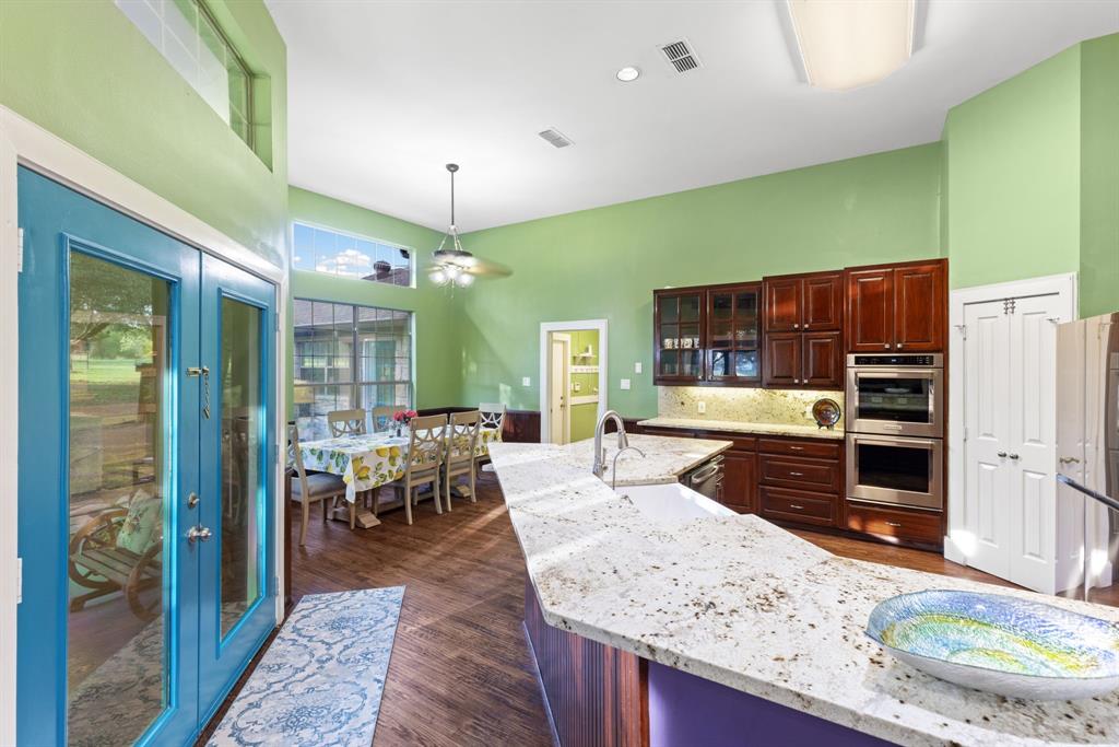 708 Sam Davis Road Argyle, TX 76226 - Photo 11 of 36 a large living room with stainless steel appliances granite countertop furniture and a view of living room