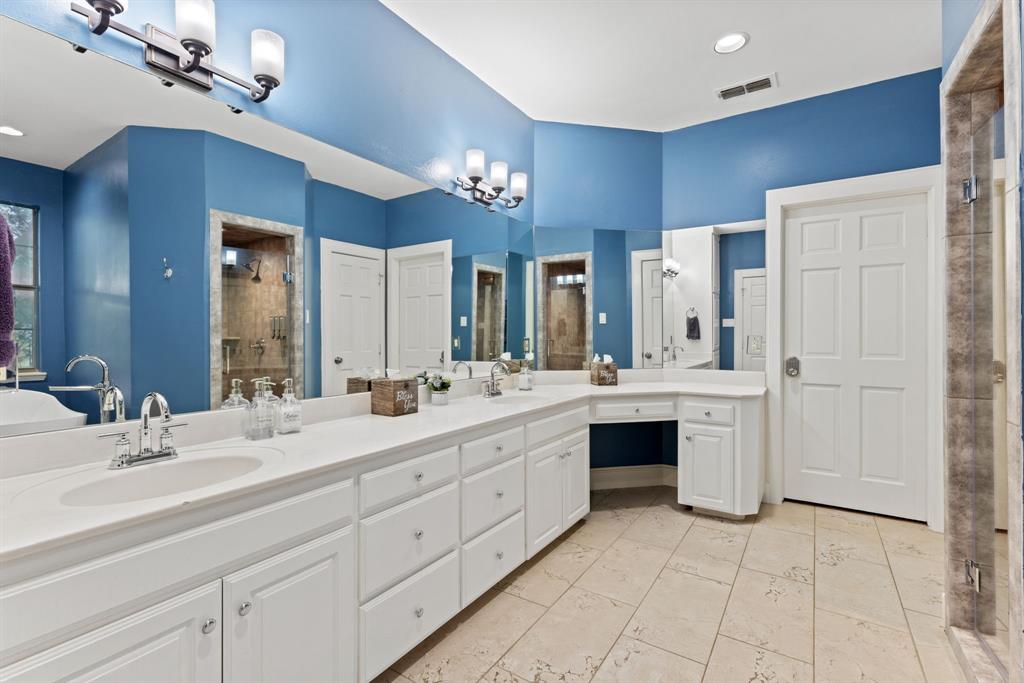708 Sam Davis Road Argyle, TX 76226 - Photo 12 of 36 a bathroom with a double vanity sink double and mirror