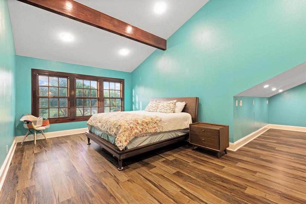 708 Sam Davis Road Argyle, TX 76226 - Photo 19 of 36 a bedroom with a bed and wooden floor