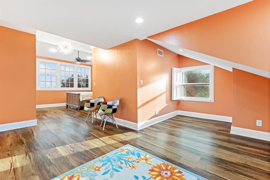 708 Sam Davis Road Argyle, TX 76226 - Photo 21 of 36 an empty room with wooden floor and windows