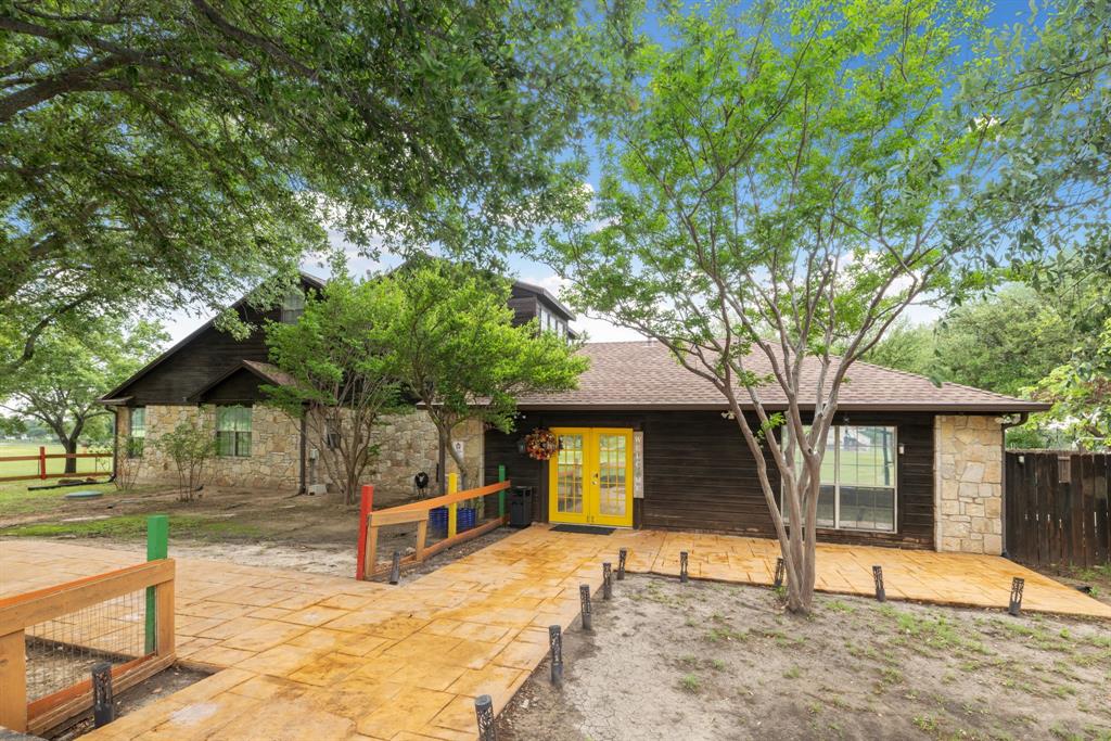 708 Sam Davis Road Argyle, TX 76226 - Photo 27 of 36 a view of a house with a tree in the yard