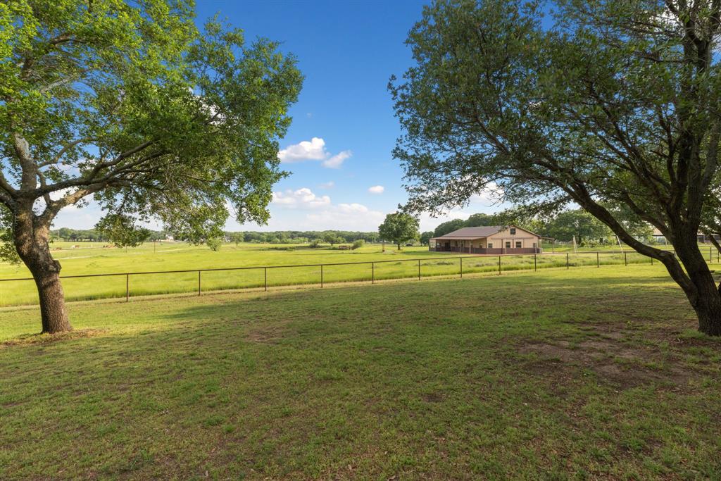 708 Sam Davis Road Argyle, TX 76226 - Photo 35 of 36 a view of a field with trees
