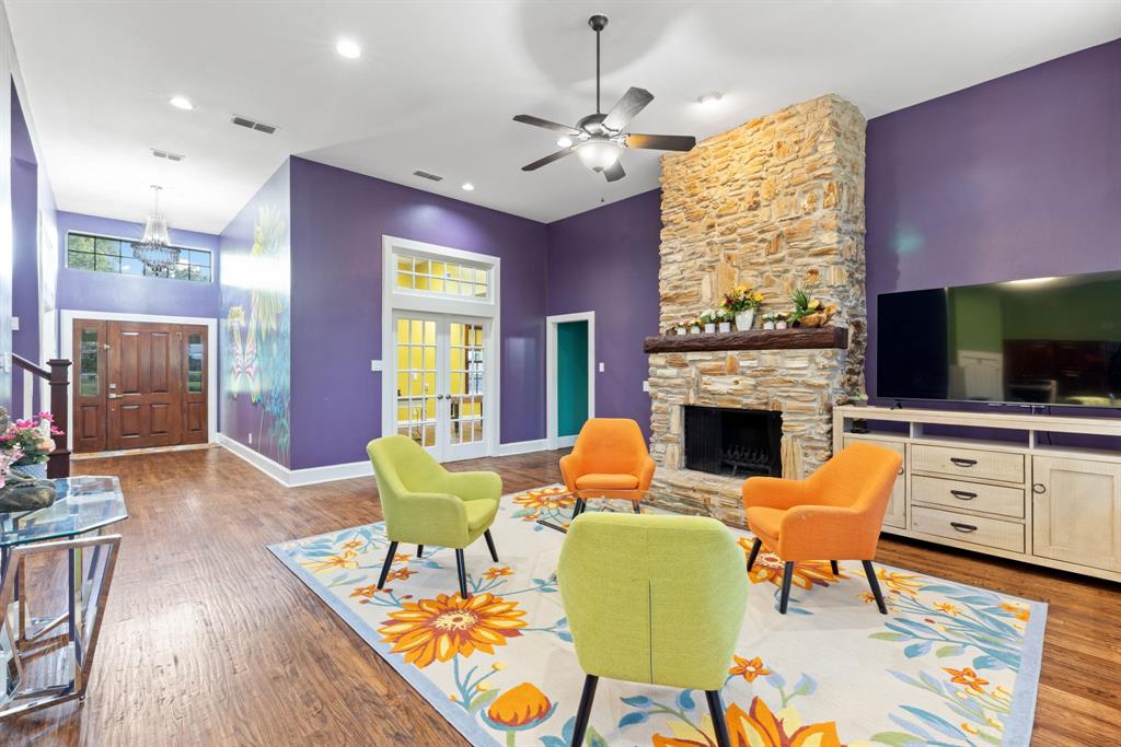 708 Sam Davis Road Argyle, TX 76226 - Photo 10 of 36 a living room with furniture a fireplace and a flat screen tv