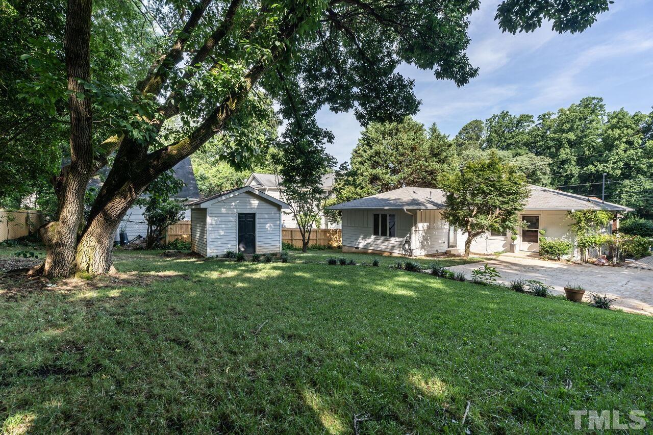 114 Hudson Street Raleigh, NC 27608 - Photo 23 of 23 a front view of a house with a garden