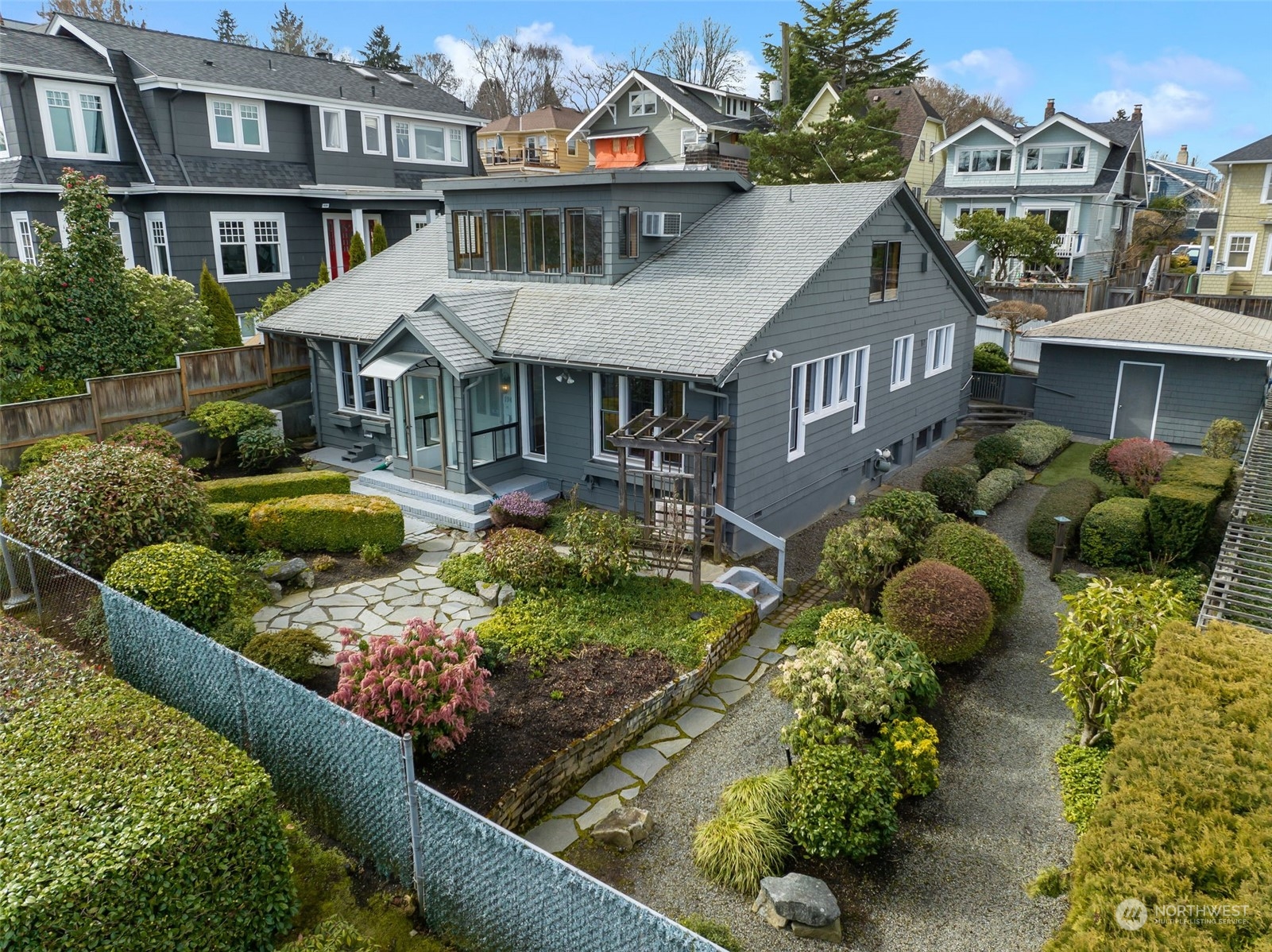 1941 15th Avenue East Seattle, WA 98112 - Photo 1 of 37 a front view of a house with a yard and outdoor seating