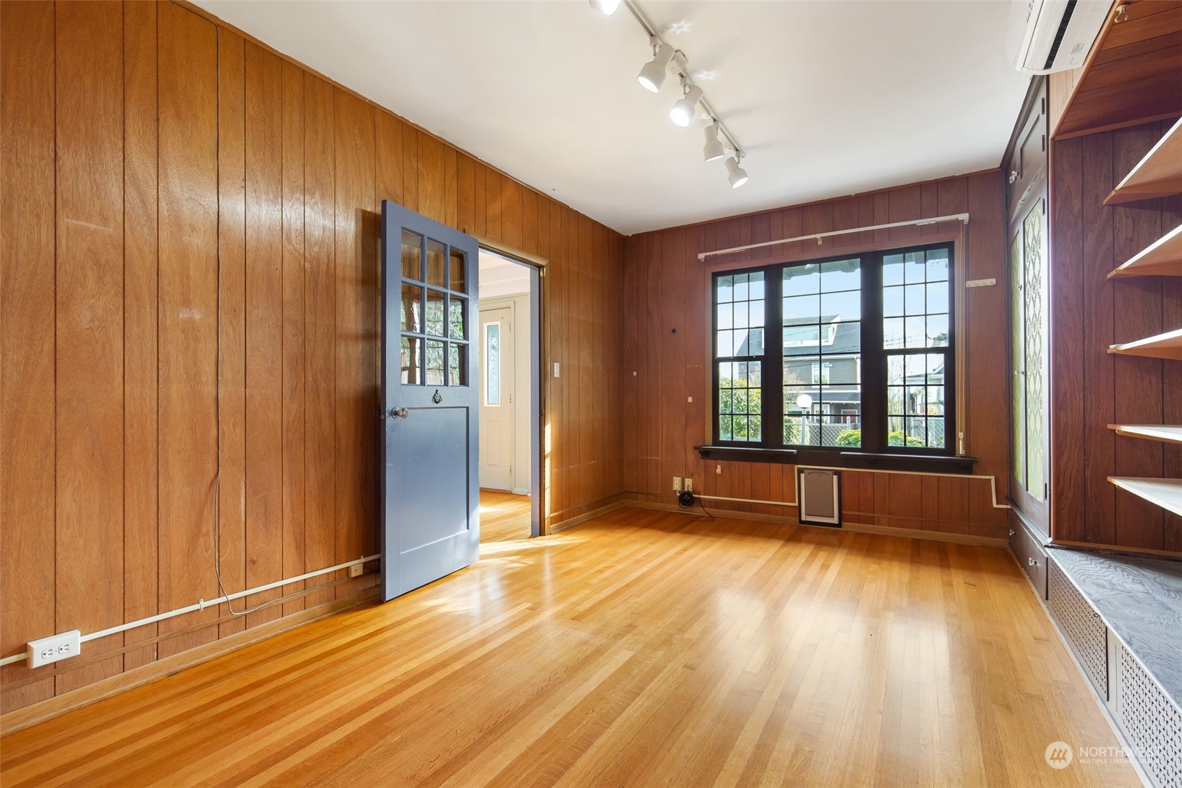 1941 15th Avenue East Seattle, WA 98112 - Photo 18 of 37 an empty room with wooden floor and windows