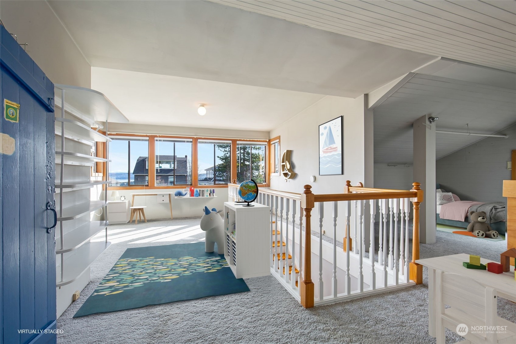1941 15th Avenue East Seattle, WA 98112 - Photo 23 of 37 a living room with a baby crib furniture and a kitchen view