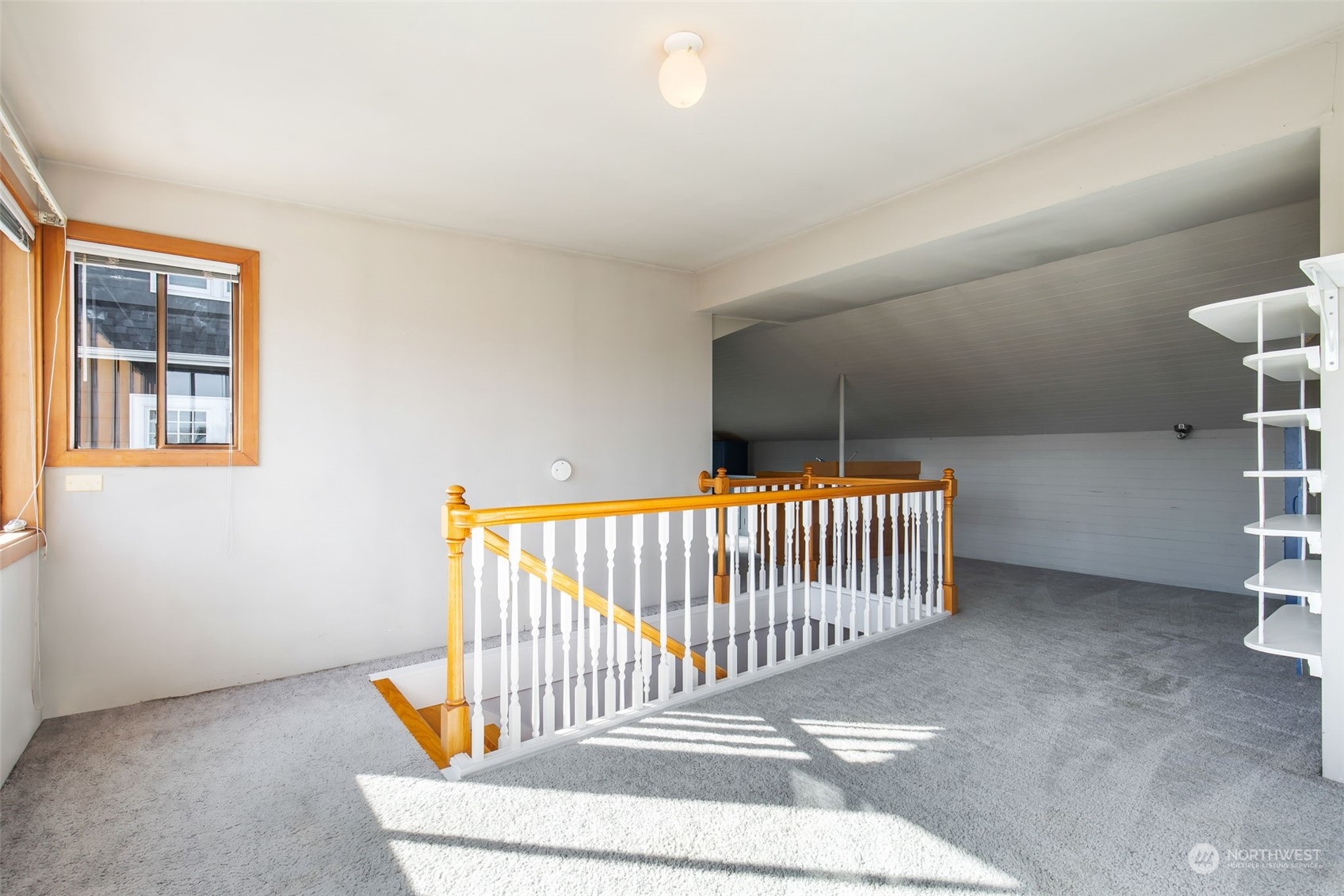 1941 15th Avenue East Seattle, WA 98112 - Photo 27 of 37 a bedroom with furniture and a window