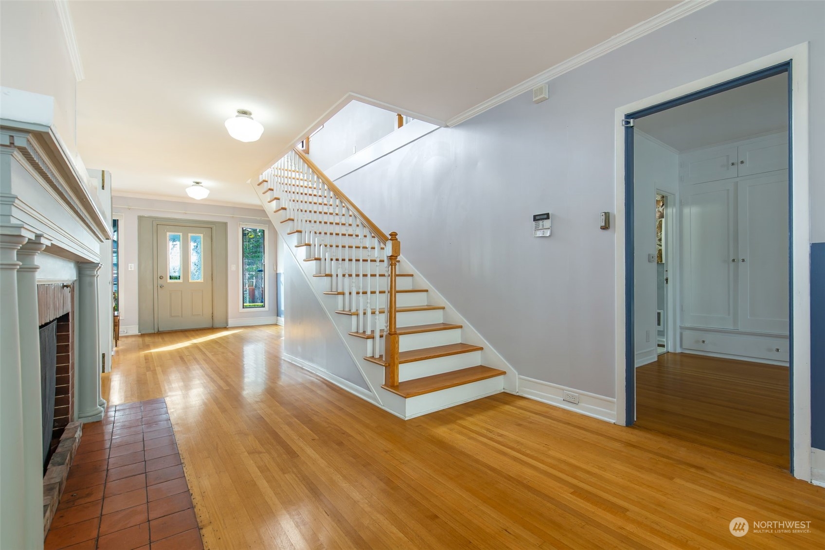 1941 15th Avenue East Seattle, WA 98112 - Photo 4 of 37 a view of entryway and hall with wooden floor