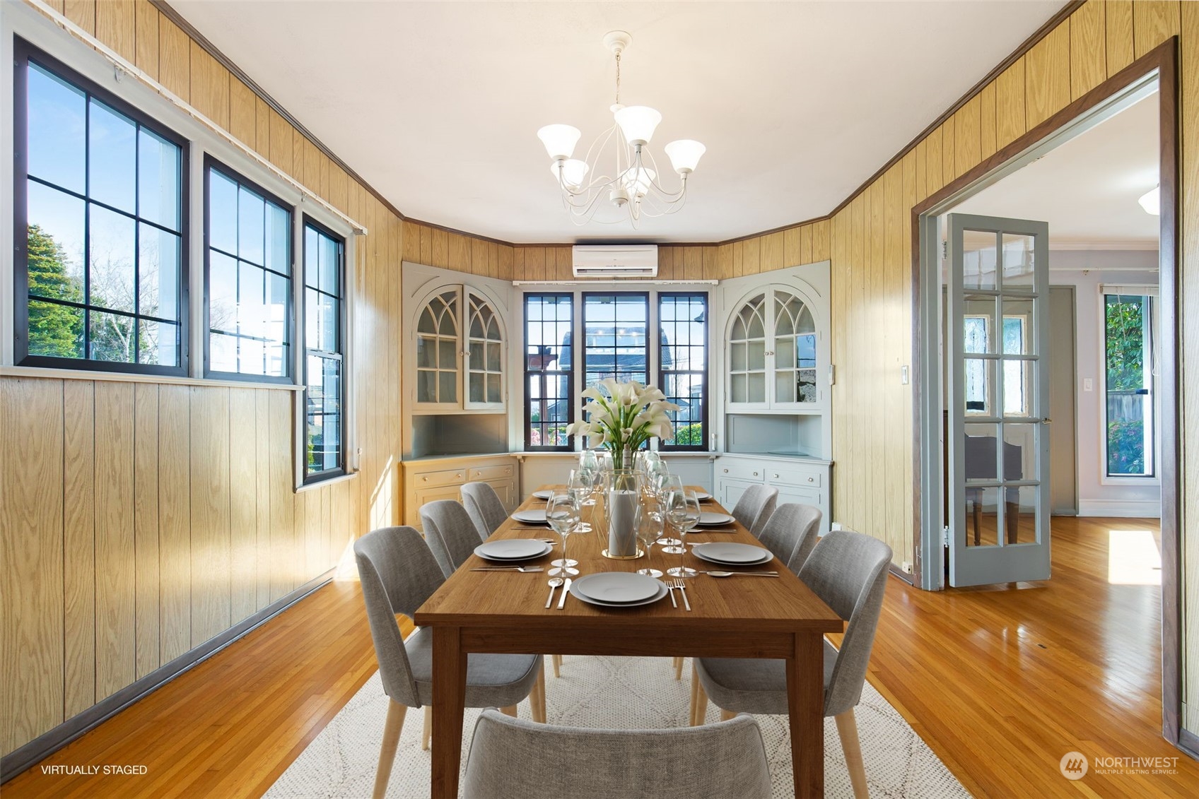 1941 15th Avenue East Seattle, WA 98112 - Photo 5 of 37 a view of a dining room with furniture wooden floor and chandelier