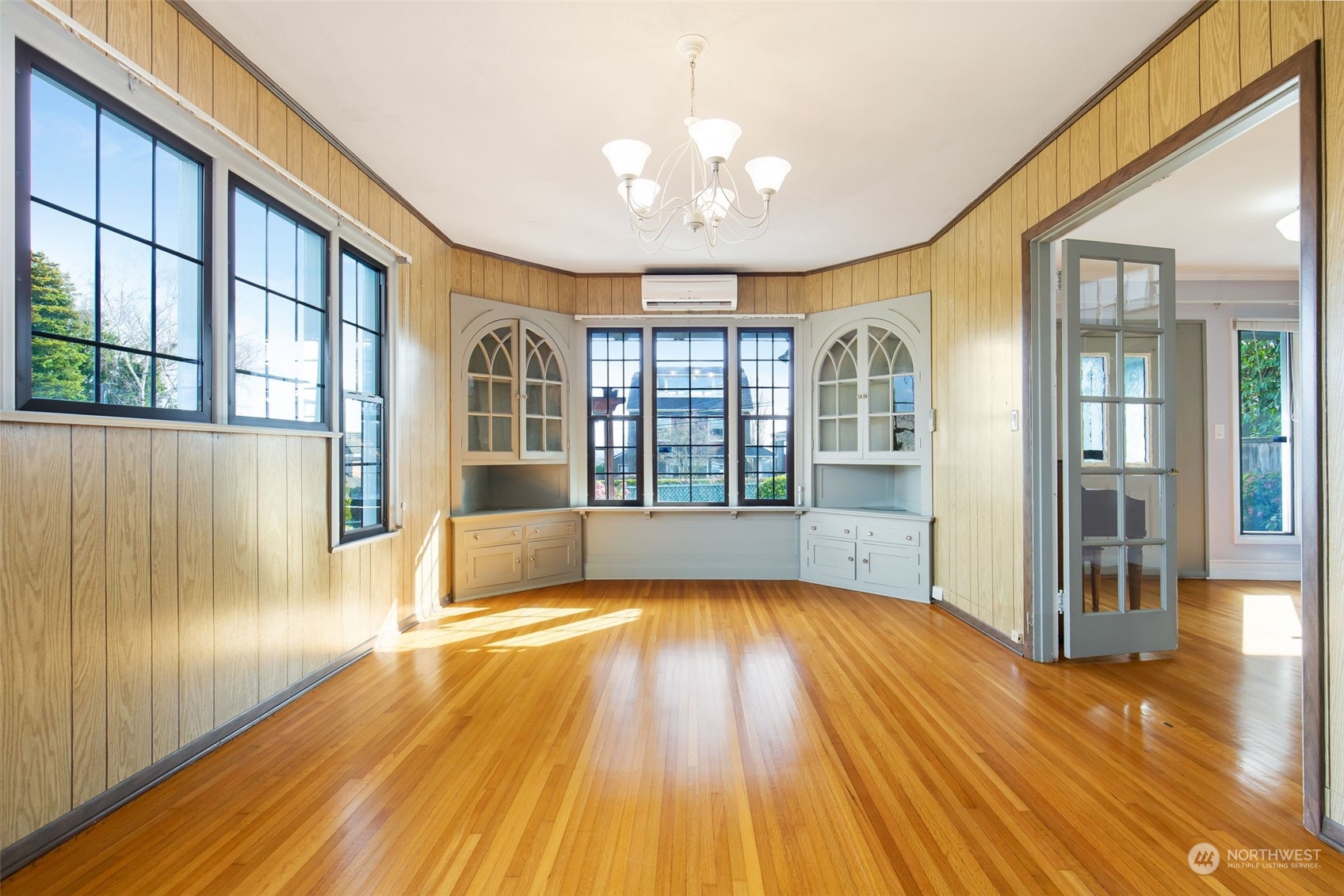 1941 15th Avenue East Seattle, WA 98112 - Photo 6 of 37 a view of an empty room with wooden floor and a window
