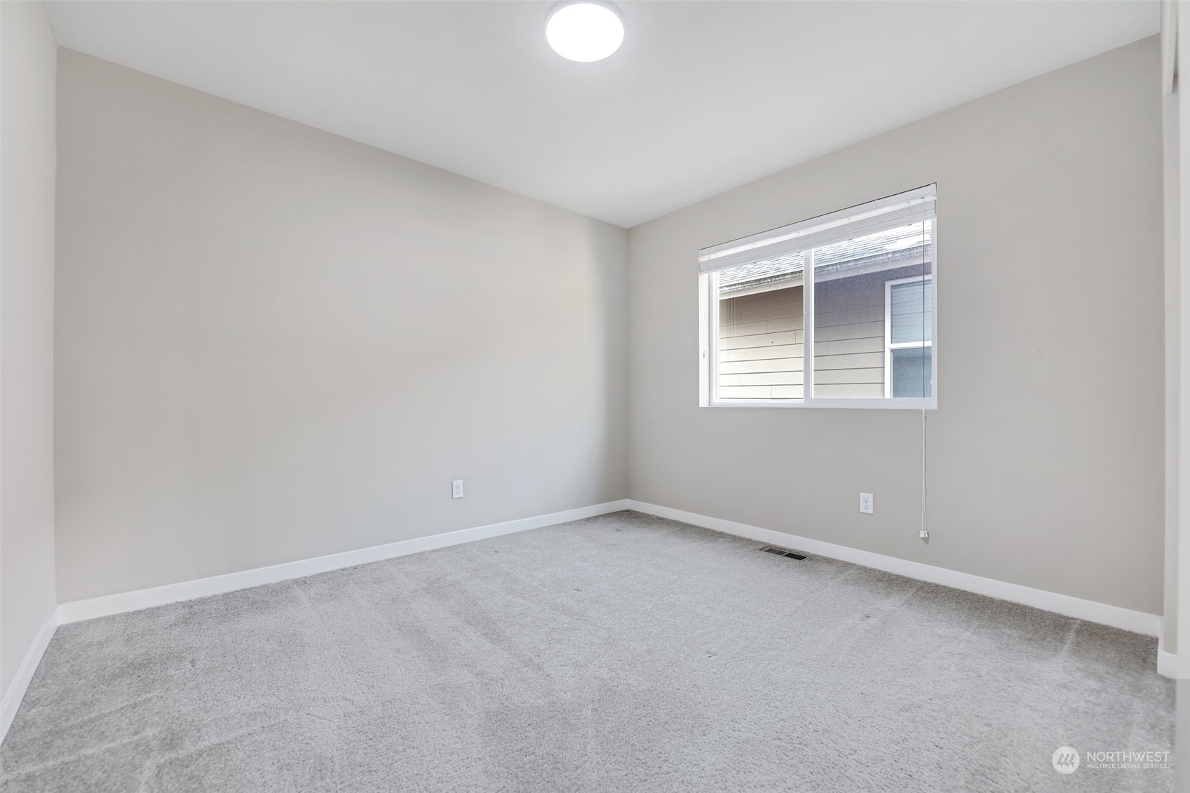 1102 120th Street Southeast Everett, WA 98208 - Photo 22 of 28 an empty room with a window