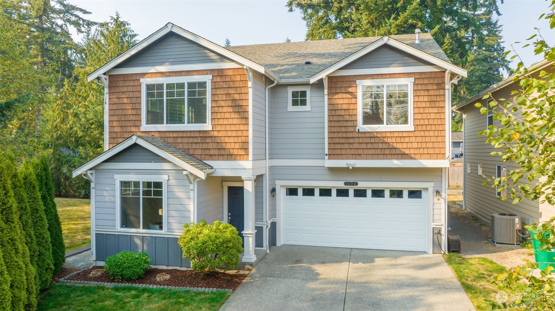 1102 120th Street Southeast Everett, WA 98208 - Photo 27 of 28 a front view of a house with garden