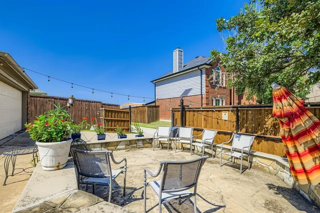 a view of a patio with couches and potted plants