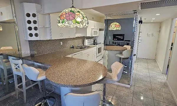 a very nice looking dining room with a table and chairs in it