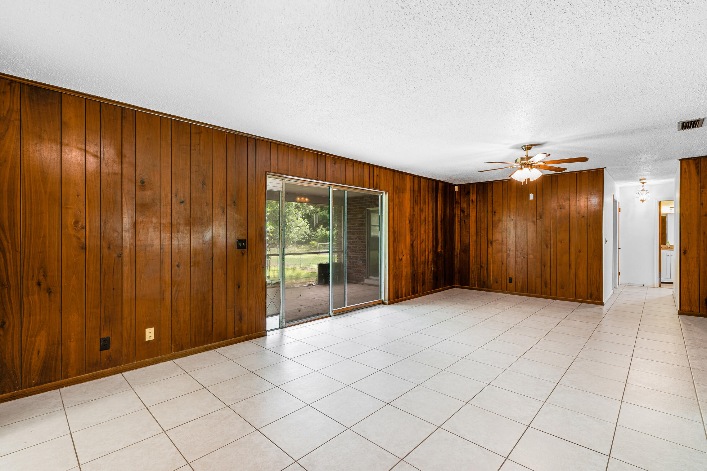 15707 Collecting Canal Road Loxahatchee Groves, FL 33470 - Photo 6 of 30 Family Room w Pocket Sliders