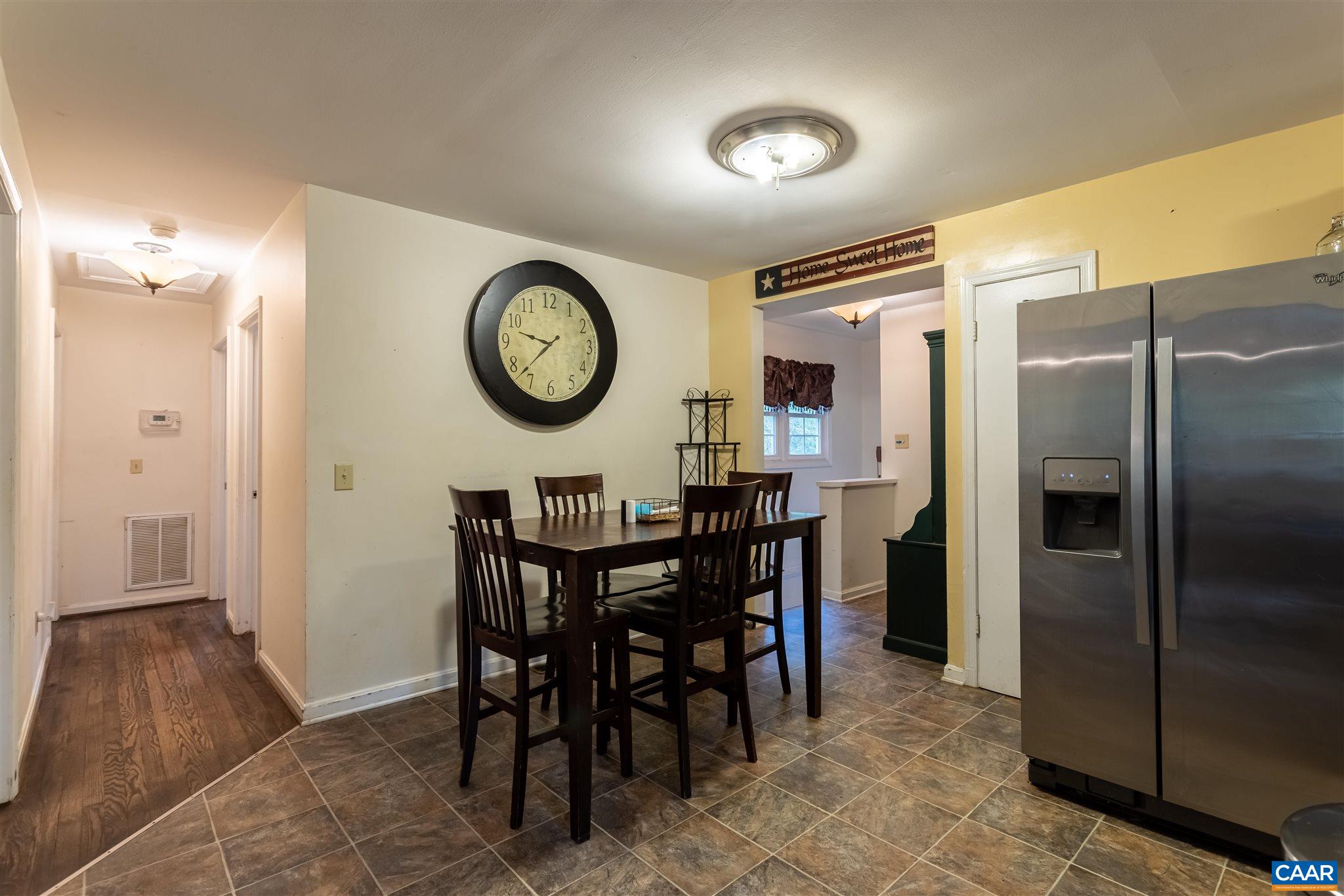 2588 South Blue Ridge Turnpike Rochelle, VA 22738 - Photo 12 of 30 a view of a dining area with furniture and a large window