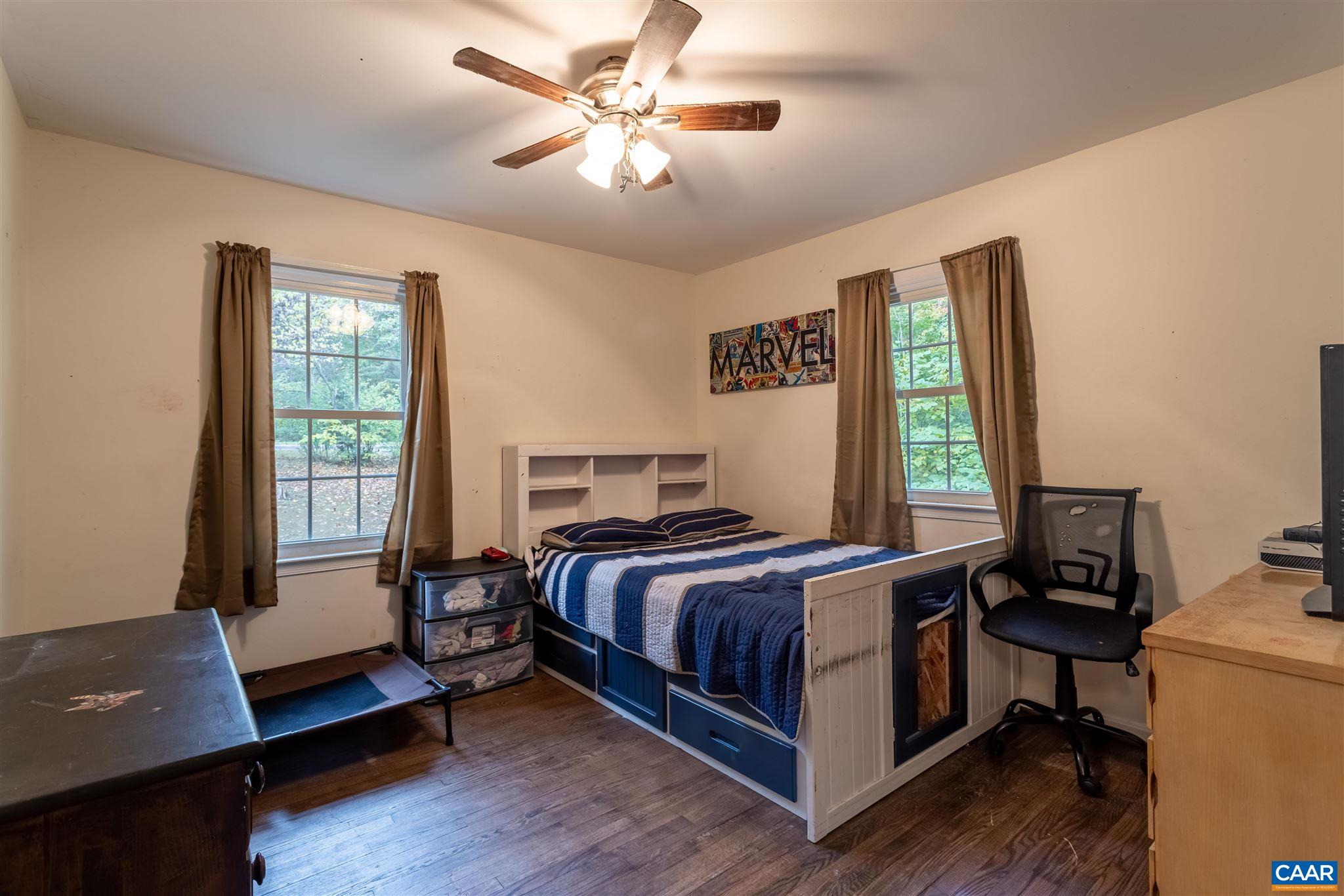 2588 South Blue Ridge Turnpike Rochelle, VA 22738 - Photo 18 of 30 a bedroom with a bed and a window