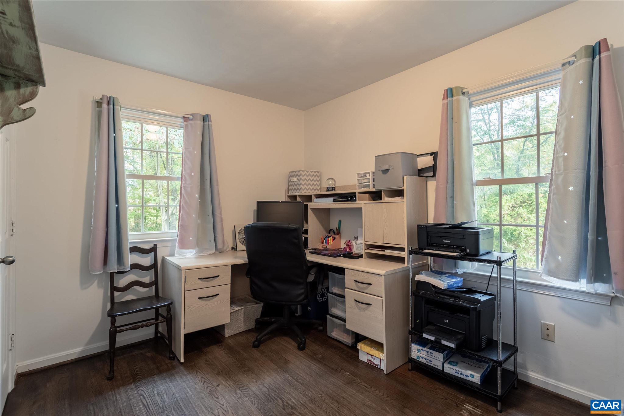 2588 South Blue Ridge Turnpike Rochelle, VA 22738 - Photo 19 of 30 a view of a workspace with furniture and a window