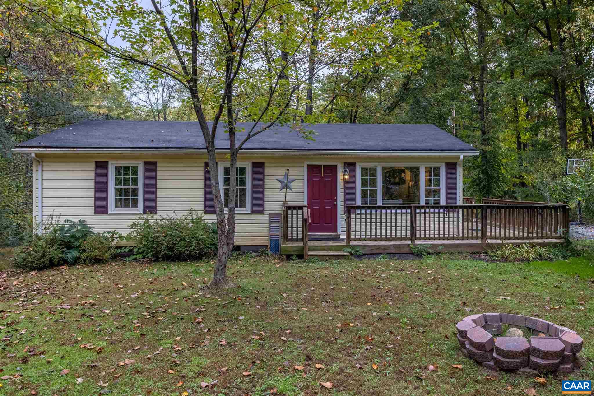 2588 South Blue Ridge Turnpike Rochelle, VA 22738 - Photo 24 of 30 a view of a house with a yard potted plants and large tree