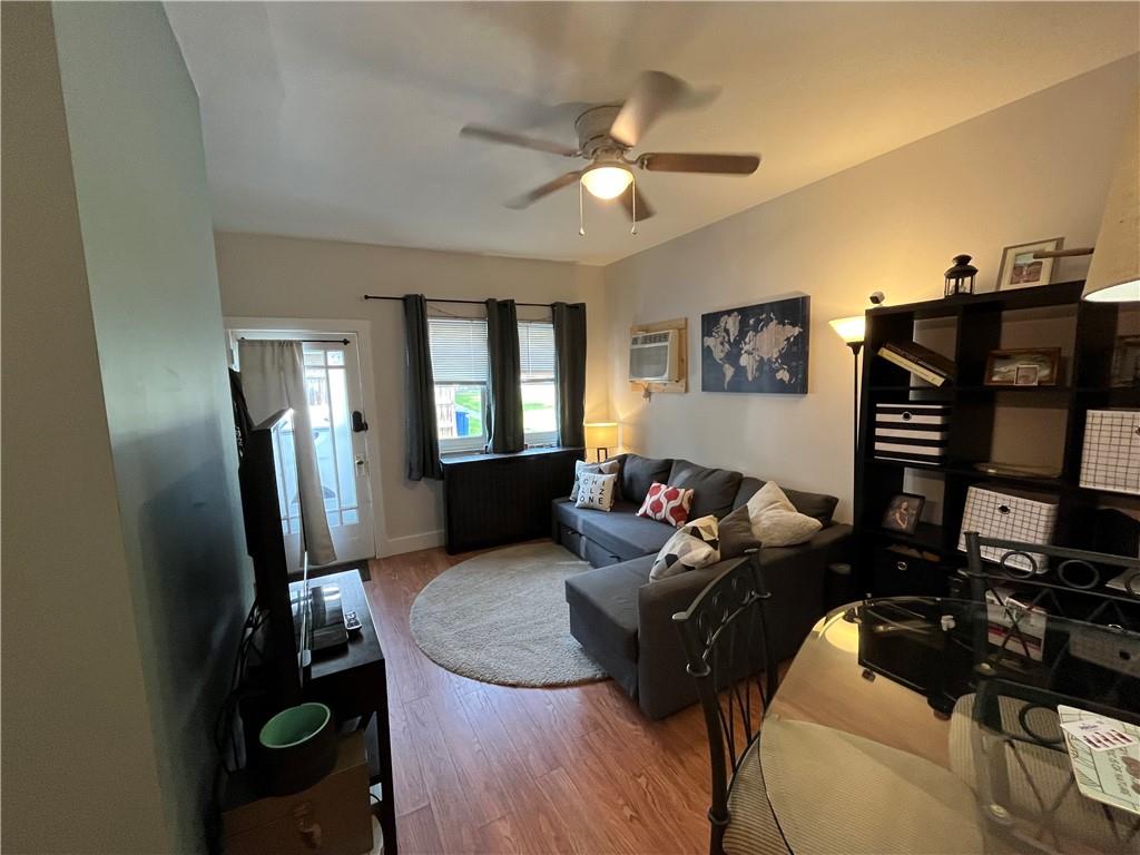 1716 Snow Way Pittsburgh, PA 15206 - Photo 11 of 21 a living room with furniture and a flat screen tv
