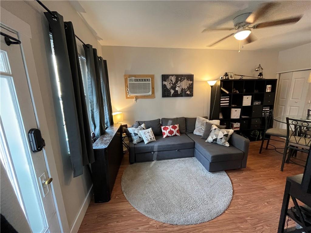 1716 Snow Way Pittsburgh, PA 15206 - Photo 12 of 21 a living room with furniture and a large window