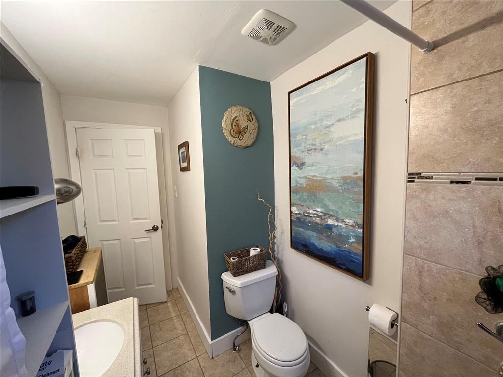 1716 Snow Way Pittsburgh, PA 15206 - Photo 13 of 21 a white toilet sitting next to a bathroom sink