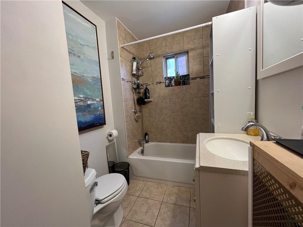 1716 Snow Way Pittsburgh, PA 15206 - Photo 14 of 21 a bathroom with a sink a toilet and shower