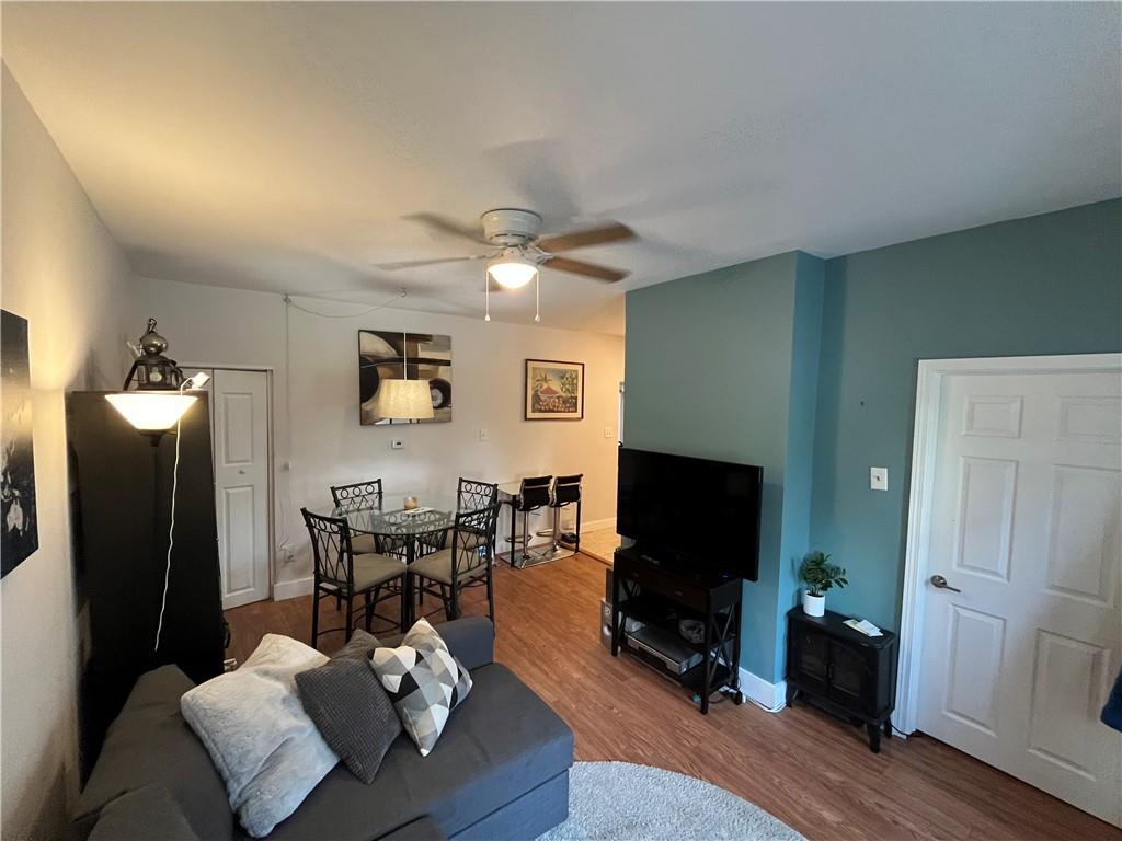 1716 Snow Way Pittsburgh, PA 15206 - Photo 3 of 21 a living room with furniture and a flat screen tv