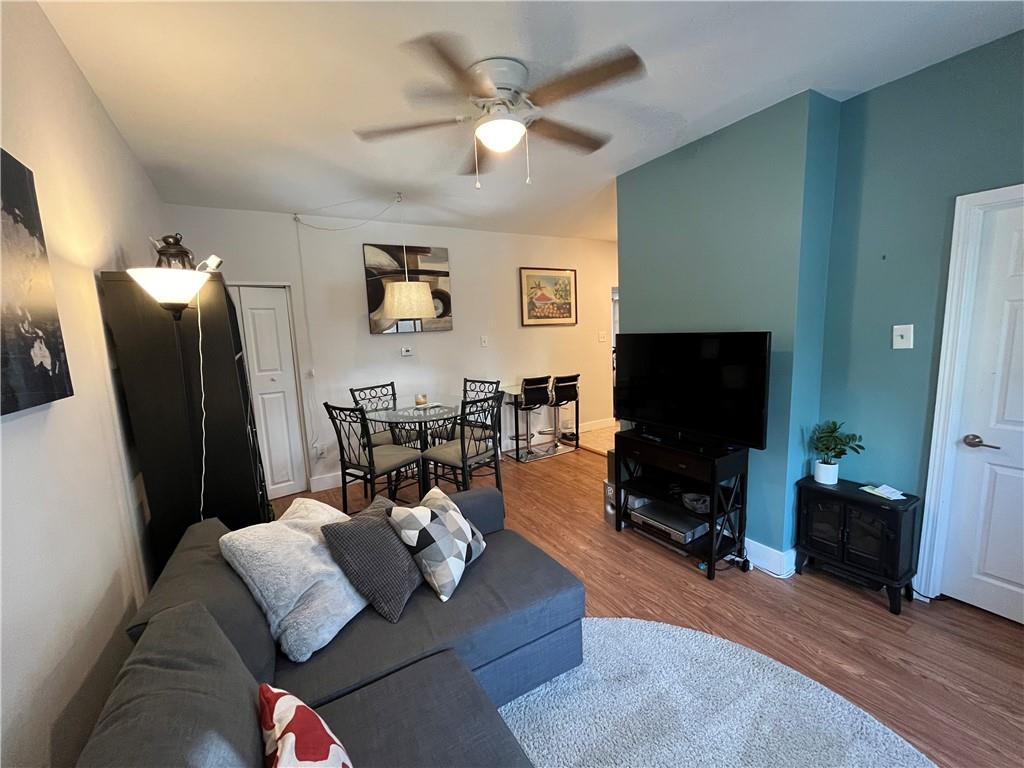 1716 Snow Way Pittsburgh, PA 15206 - Photo 4 of 21 a living room with furniture and a flat screen tv