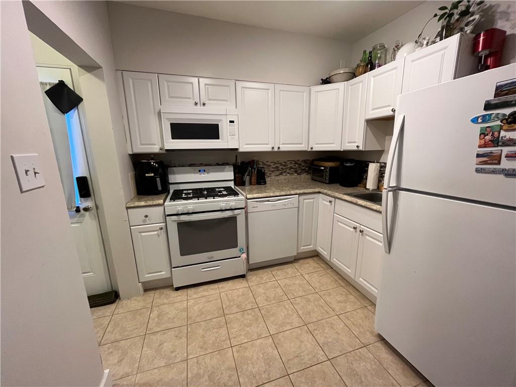 1716 Snow Way Pittsburgh, PA 15206 - Photo 6 of 21 a kitchen with cabinets stainless steel appliances and sink