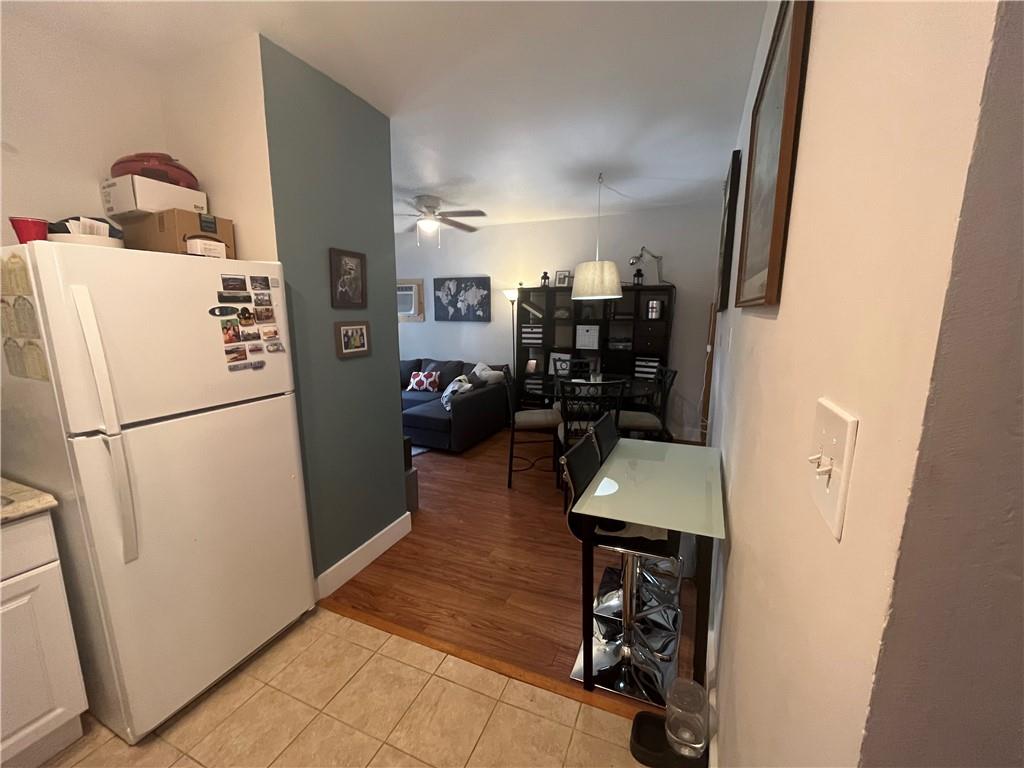 1716 Snow Way Pittsburgh, PA 15206 - Photo 7 of 21 a room with refrigerator and washer