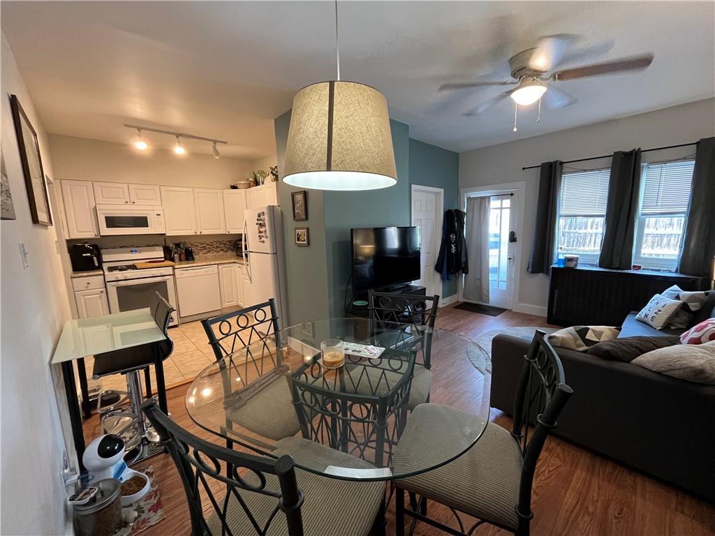 1716 Snow Way Pittsburgh, PA 15206 - Photo 9 of 21 a view of a dining room with furniture window and wooden floor