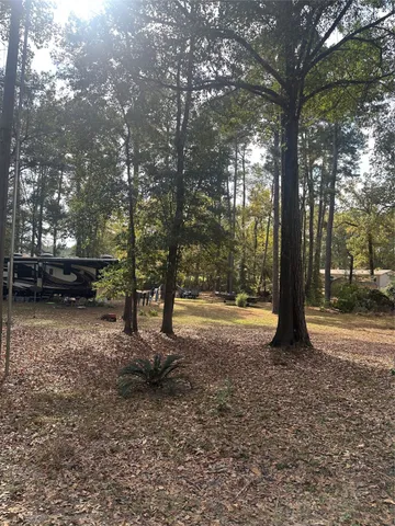 a view of outdoor space with deck and tree