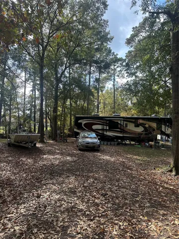 a backyard of a house with lots of green space