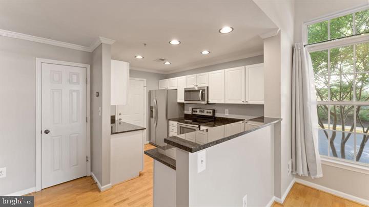 1918 Crescent Park Drive Reston, VA 20190 - Photo 10 of 33 Modern kitchen with sleek finishes.