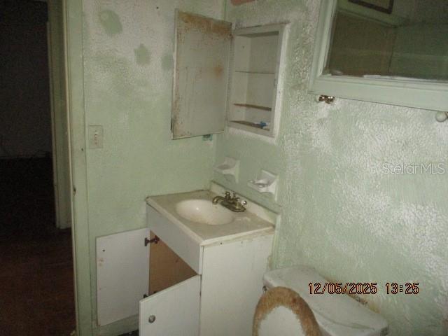 4175 Covington Street Orlando, FL 32811 - Photo 12 of 19 a bathroom with a sink toilet and shower