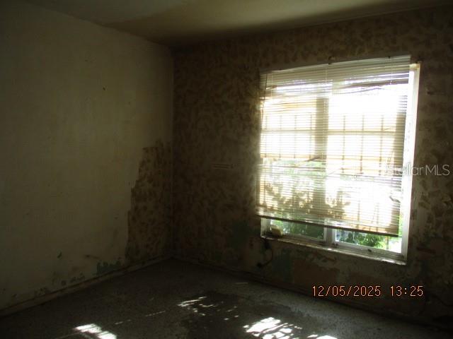 4175 Covington Street Orlando, FL 32811 - Photo 15 of 19 a view of an empty room and a window