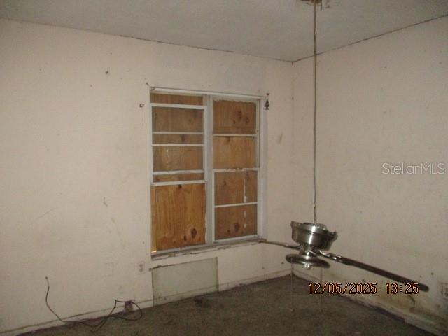 4175 Covington Street Orlando, FL 32811 - Photo 17 of 19 a room with gym equipment and a window
