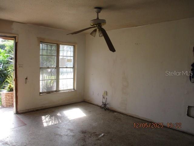 4175 Covington Street Orlando, FL 32811 - Photo 6 of 19 an empty room with windows