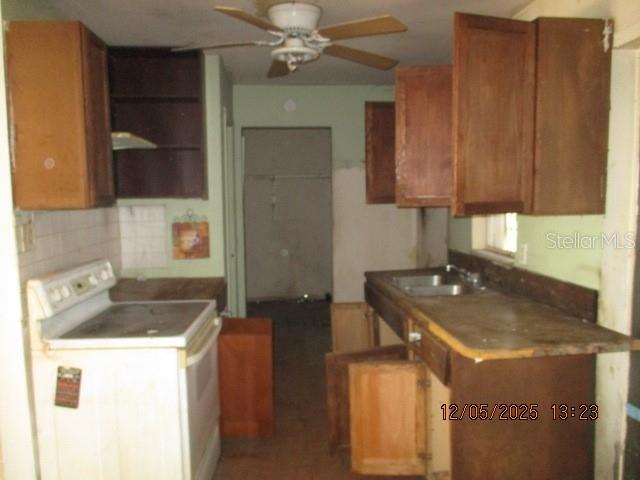 4175 Covington Street Orlando, FL 32811 - Photo 9 of 19 a bathroom with a sink and a mirror