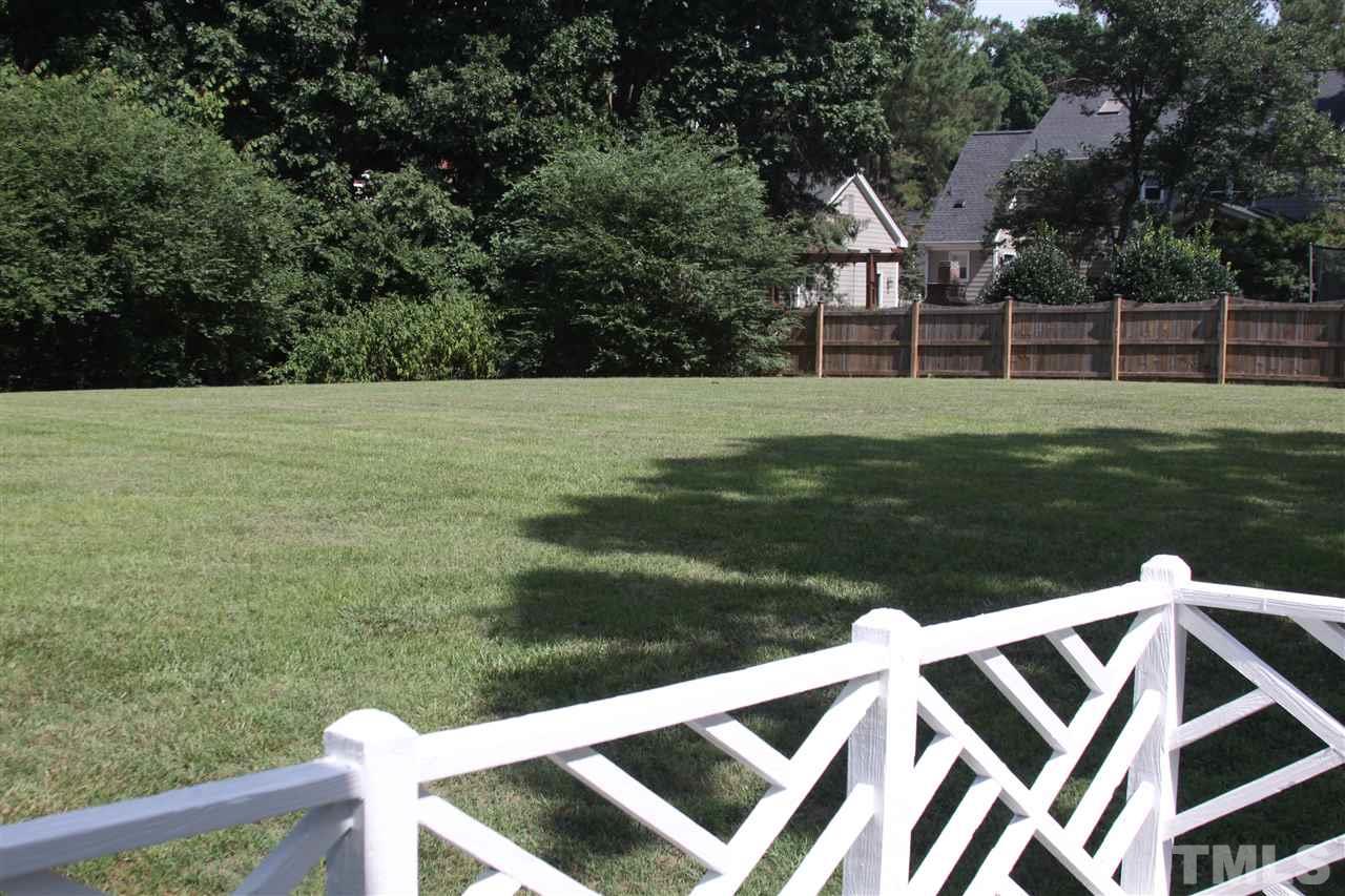 8305 Harps Mill Road Raleigh, NC 27615 - Photo 3 of 19 a view of a wooden deck and a yard