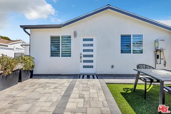 a house view with a garden space