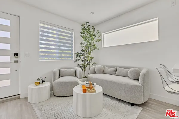 a living room with furniture and window
