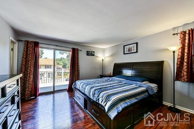 74 Briar Avenue Edison, NJ 08817 - Photo 18 of 30 a bedroom with a bed and wooden floor